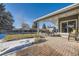 Enjoy this backyard patio, complete with a seating area and string lights at 6995 S Ash Cir, Centennial, CO 80122