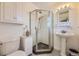 Updated bathroom with pedestal sink and shower at 6995 S Ash Cir, Centennial, CO 80122