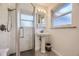 Clean bathroom with pedestal sink and shower at 6995 S Ash Cir, Centennial, CO 80122