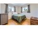 Well-lit bedroom with hardwood floors and window at 6995 S Ash Cir, Centennial, CO 80122