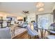 Open concept dining area with hardwood floors and modern light fixture at 6995 S Ash Cir, Centennial, CO 80122