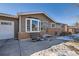 Front view of a remodeled ranch home with a bay window at 6995 S Ash Cir, Centennial, CO 80122