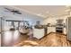 Modern kitchen with white cabinets, stainless steel appliances, and hardwood floors at 6995 S Ash Cir, Centennial, CO 80122