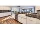 Bright kitchen with white cabinets, granite counters, and stainless steel appliances at 6995 S Ash Cir, Centennial, CO 80122