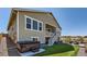 Backyard features a hot tub, patio with furniture, artificial grass and steps to the deck at 14521 Vancouver Pl, Parker, CO 80134