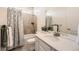 Bathroom with a combo tub/shower, granite counters, and stylish accents at 14521 Vancouver Pl, Parker, CO 80134
