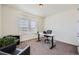 Bright office space with large windows, modern desk, and comfortable chair, perfect for working from home at 14521 Vancouver Pl, Parker, CO 80134