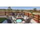Outdoor seating with a firepit overlooking a landscaped backyard and surrounding community at 14521 Vancouver Pl, Parker, CO 80134