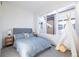 Bright bedroom with a large window, a gray bed, and a decorative teepee for a playful aesthetic at 2920 W Parkside Pl, Denver, CO 80221