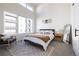 Bright bedroom features high ceilings, large windows and neutral decor at 2920 W Parkside Pl, Denver, CO 80221