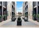 Charming courtyard with tables, chairs, and landscaping that creates an inviting outdoor space at 2920 W Parkside Pl, Denver, CO 80221