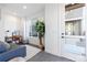 Inviting living room with a cozy sofa, desk, and a view of the outside enhancing the space at 2920 W Parkside Pl, Denver, CO 80221