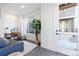 Living room with small desk, couch, and big windows at 2920 W Parkside Pl, Denver, CO 80221