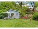 Serene backyard with shed, ample seating, and lush landscaping at 6621 E Peakview Pl, Centennial, CO 80111