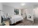 Basement bedroom with wood floors, an egress window, and a white bed at 6621 E Peakview Pl, Centennial, CO 80111