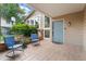 Inviting front porch with chairs and a charming entrance at 6621 E Peakview Pl, Centennial, CO 80111