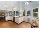 Modern kitchen with stainless steel appliances, butcher block countertops and a walkout to the patio at 6621 E Peakview Pl, Centennial, CO 80111