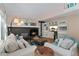 Cozy living room with a fireplace, plush seating, and stylish decor at 6621 E Peakview Pl, Centennial, CO 80111