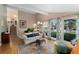 Inviting living room with large windows, staircase and hardwood floors, offering natural light at 6621 E Peakview Pl, Centennial, CO 80111