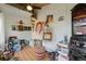 Bright studio space with an easel, art supplies, and finished floors at 6621 E Peakview Pl, Centennial, CO 80111