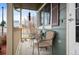 Covered front porch has seating and seasonal decor for relaxation and curb appeal at 11207 Day Star Ct, Parker, CO 80138