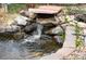 Close-up of backyard pond waterfall feature at 11207 Day Star Ct, Parker, CO 80138