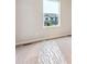 Bright bedroom features a neutral color palette and a view of the neighborhood at 19019 E 94Th Pl, Commerce City, CO 80022
