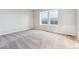 Spacious bedroom featuring plush carpeting and natural light from windows at 19019 E 94Th Pl, Commerce City, CO 80022