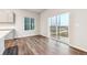 Dining room with wood floors and sliding glass door leading to the outside at 19019 E 94Th Pl, Commerce City, CO 80022