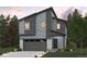 Modern two-story home with gray siding, white brick accents, and a two-car garage at 19019 E 94Th Pl, Commerce City, CO 80022
