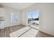 Bright room with sliding glass doors to exterior view; light wood flooring at 19019 E 94Th Pl, Commerce City, CO 80022