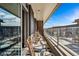 Relaxing balcony with seating area and glass railings to maximize the view at 4200 W 17Th Ave # 327, Denver, CO 80204