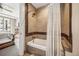Stylish bathroom features a shower-tub with tiled walls and decorative shower curtain at 4200 W 17Th Ave # 327, Denver, CO 80204