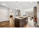 Kitchen island with dark wood cabinets, stainless steel appliances, and hardwood floors at 4200 W 17Th Ave # 327, Denver, CO 80204