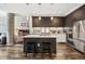 Modern kitchen with dark cabinets, white countertops, and stainless steel appliances at 4200 W 17Th Ave # 327, Denver, CO 80204