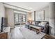 Cozy living room with a plush sectional sofa, neutral tones, access to a balcony, and a modern design at 4200 W 17Th Ave # 327, Denver, CO 80204