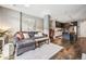 Inviting living room featuring hardwood floors, stylish decor, comfortable seating and an open concept to the kitchen at 4200 W 17Th Ave # 327, Denver, CO 80204