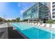 Stunning pool with lounge chairs and clear blue water next to modern apartment buildings perfect for relaxation at 4200 W 17Th Ave # 327, Denver, CO 80204