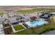 Beautiful aerial view of a community center, pool, parking, and sports facilities with open land surrounding it at 5142 N Quemoy Ct, Aurora, CO 80019