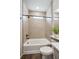 Bright bathroom featuring a tub with tiling, quartz counters and modern fixtures at 5142 N Quemoy Ct, Aurora, CO 80019