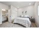 Bedroom with neutral tones, a window, ensuite bathroom and closet providing a clean space at 5142 N Quemoy Ct, Aurora, CO 80019