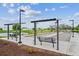 Outdoor bocce ball court with seating and a view of the pond and surrounding community at 5142 N Quemoy Ct, Aurora, CO 80019