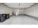 Spacious garage with ample room for parking and storage, featuring drywall and a large concrete floor at 5142 N Quemoy Ct, Aurora, CO 80019