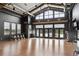 Large, airy gym area with various workout machines and floor to ceiling windows, including a view of the pool at 5142 N Quemoy Ct, Aurora, CO 80019