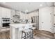 Modern kitchen with an island, stainless steel appliances, and pendant lighting at 5142 N Quemoy Ct, Aurora, CO 80019