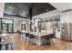 Modern kitchen featuring an island with barstool seating, stainless steel appliances, and sleek cabinetry at 5142 N Quemoy Ct, Aurora, CO 80019