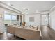 Inviting living area with hardwood floors, modern furniture, and a sliding glass door to the patio at 5142 N Quemoy Ct, Aurora, CO 80019