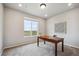 Office area featuring neutral walls, soft carpet, and natural light from the window at 5142 N Quemoy Ct, Aurora, CO 80019