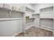 Walk-in closet with carpet and built-in shelving at 5142 N Quemoy Ct, Aurora, CO 80019