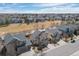 Aerial view of neighborhood featuring homes with large green space and blue skies at 15028 Clayton St, Thornton, CO 80602